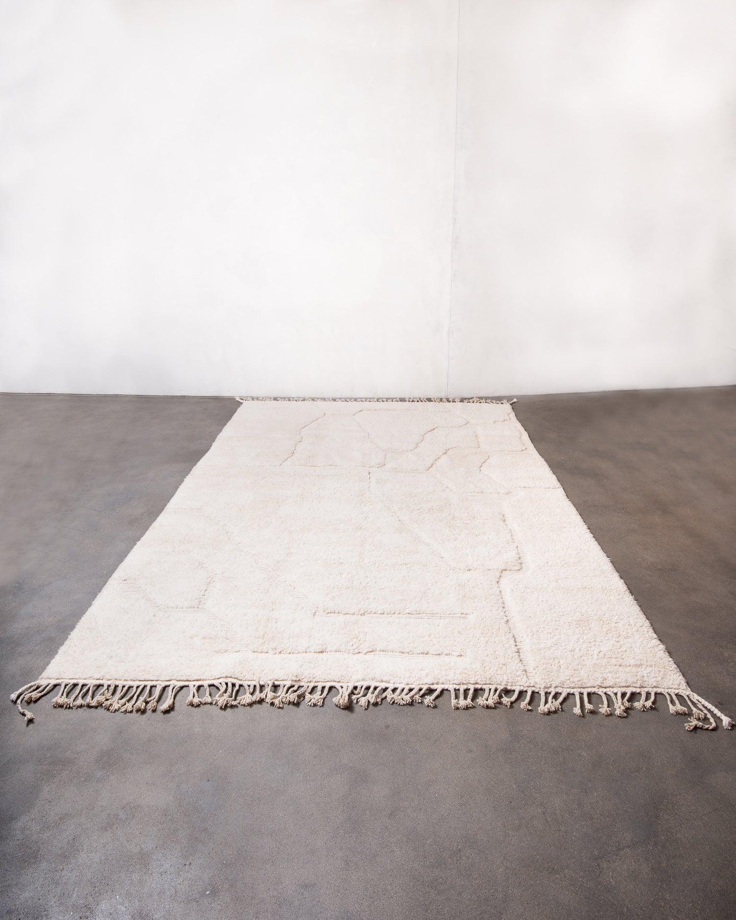 Modern, designer, handcrafted Berber rug from Morocco. Beniourain carpet with minimalist design, natural wool pile and a fluffy texture.